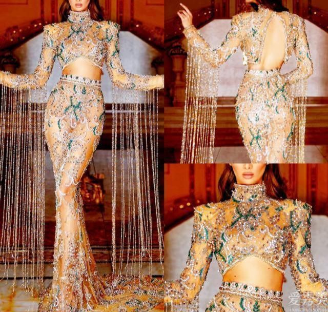 AlbinaDyla昂贵的彩色宝石礼服晶莹剔透,饰有摇曳的流苏和皇家珠饰。