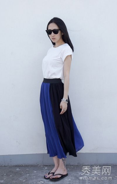 浪漫的半身裙隐藏着骄傲的肌肤，穿着高挑的身材。