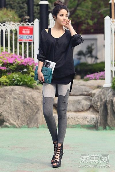 穿着宽松上衣和紧身裤的胖子在秋天看起来更苗条。